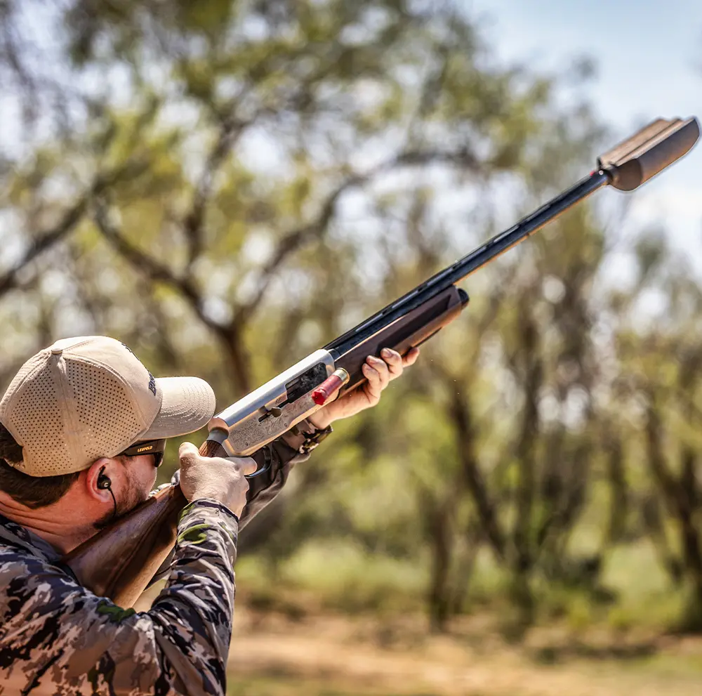 BANISH122jpg - Popular Ammo Man shooting a shotgun